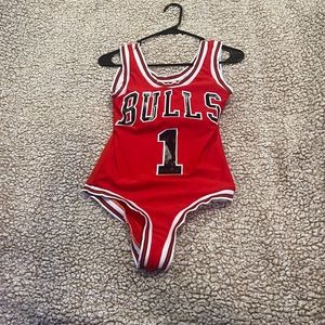 Never worn Chicago bulls onesie